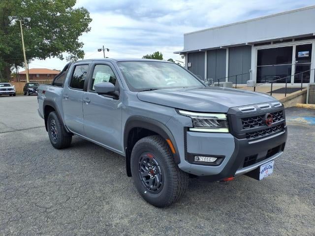 2025 Nissan Frontier Crew Cab 4x4 PRO-4X in Boulder Gray Pearl — front three-quarter view