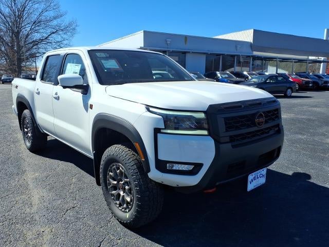 2026 Nissan Frontier Crew Cab 4x4 PRO-4X w/R Package in Glacier White — front three-quarter view