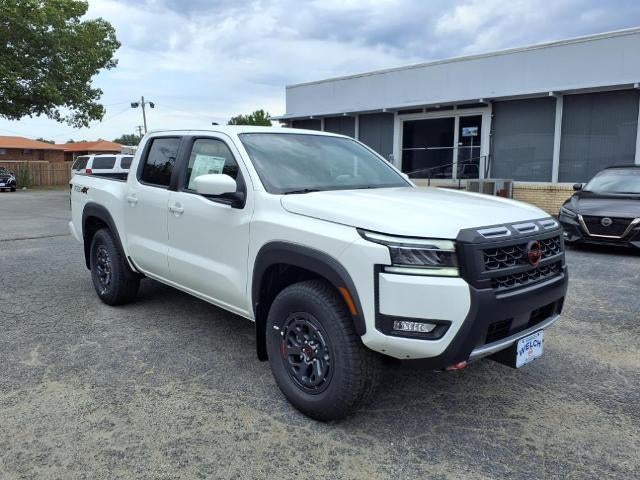 2025 Nissan Frontier Crew Cab 4x4 PRO-4X in Glacier White — front three-quarter view