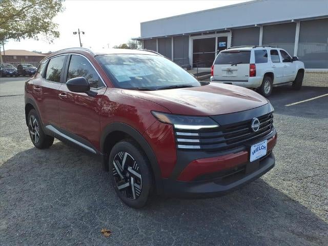 2026 Nissan Kicks SV FWD in Scarlet Ember Tintcoat — front three-quarter view
