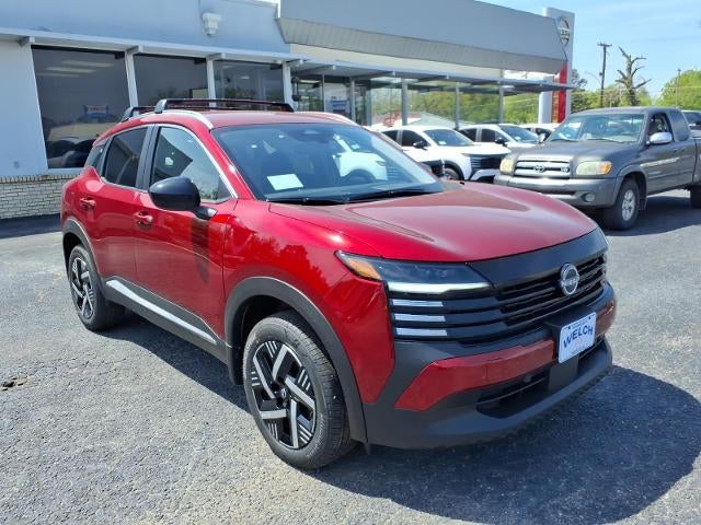 2026 Nissan Kicks SV FWD in Scarlet Ember Tintcoat — front three-quarter view