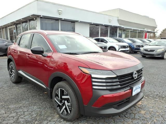 2026 Nissan Kicks SV FWD in Scarlet Ember Tintcoat — front three-quarter view